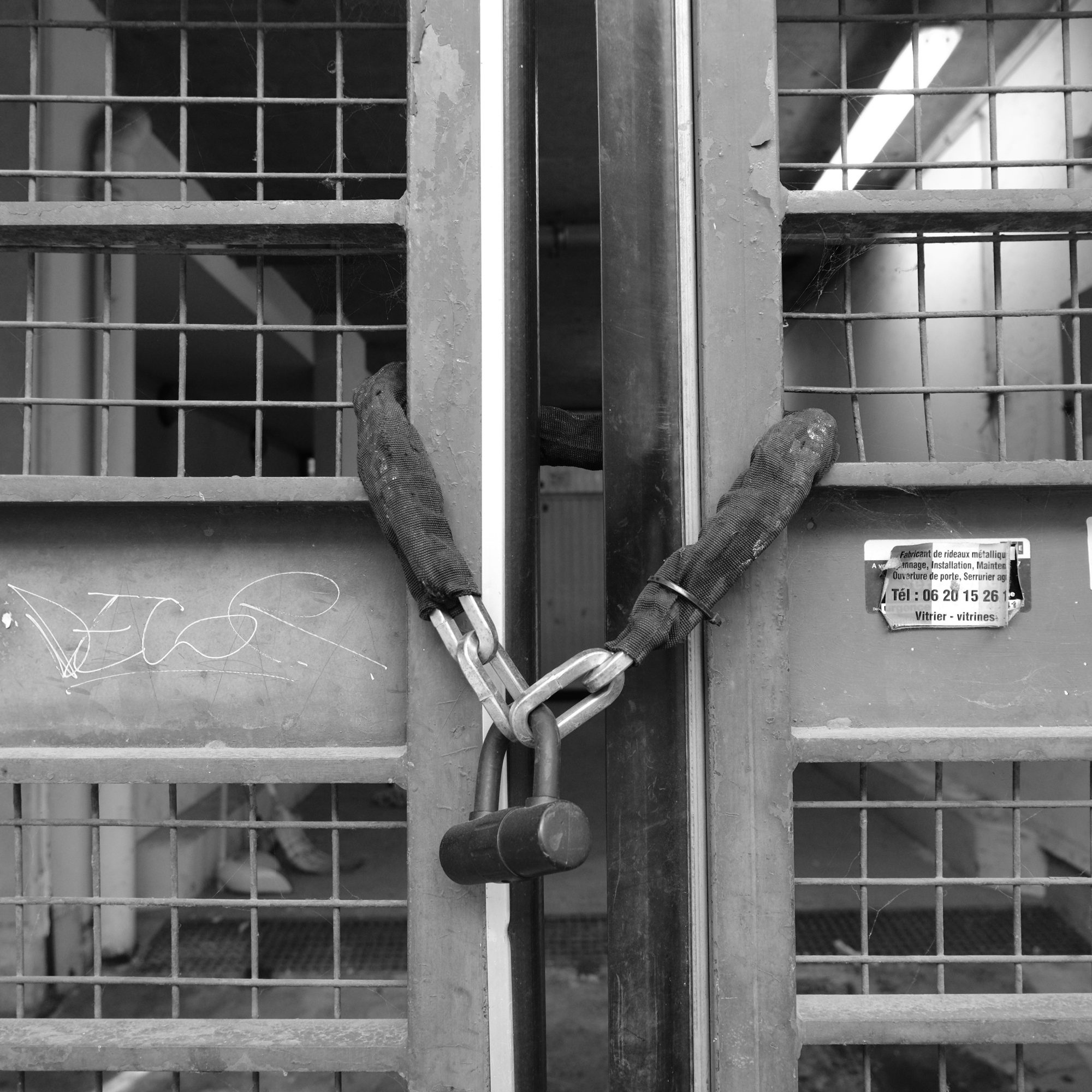 Padlocked metal gate, Stalingrad, Paris